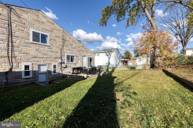 a view of a backyard of the house