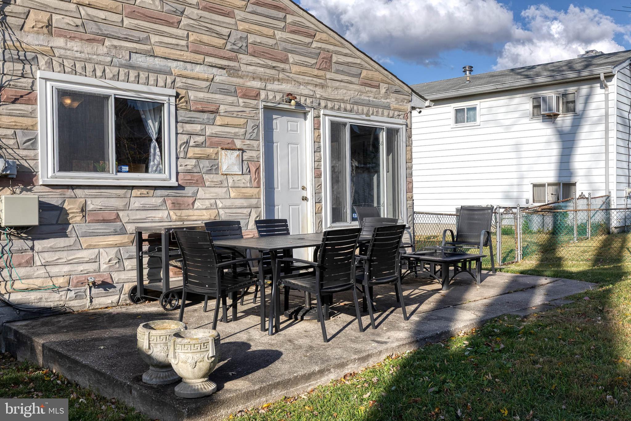 913 Marksworth Road Catonsville, MD 21228 - Photo 35 of 36 a backyard of a house with outdoor seating