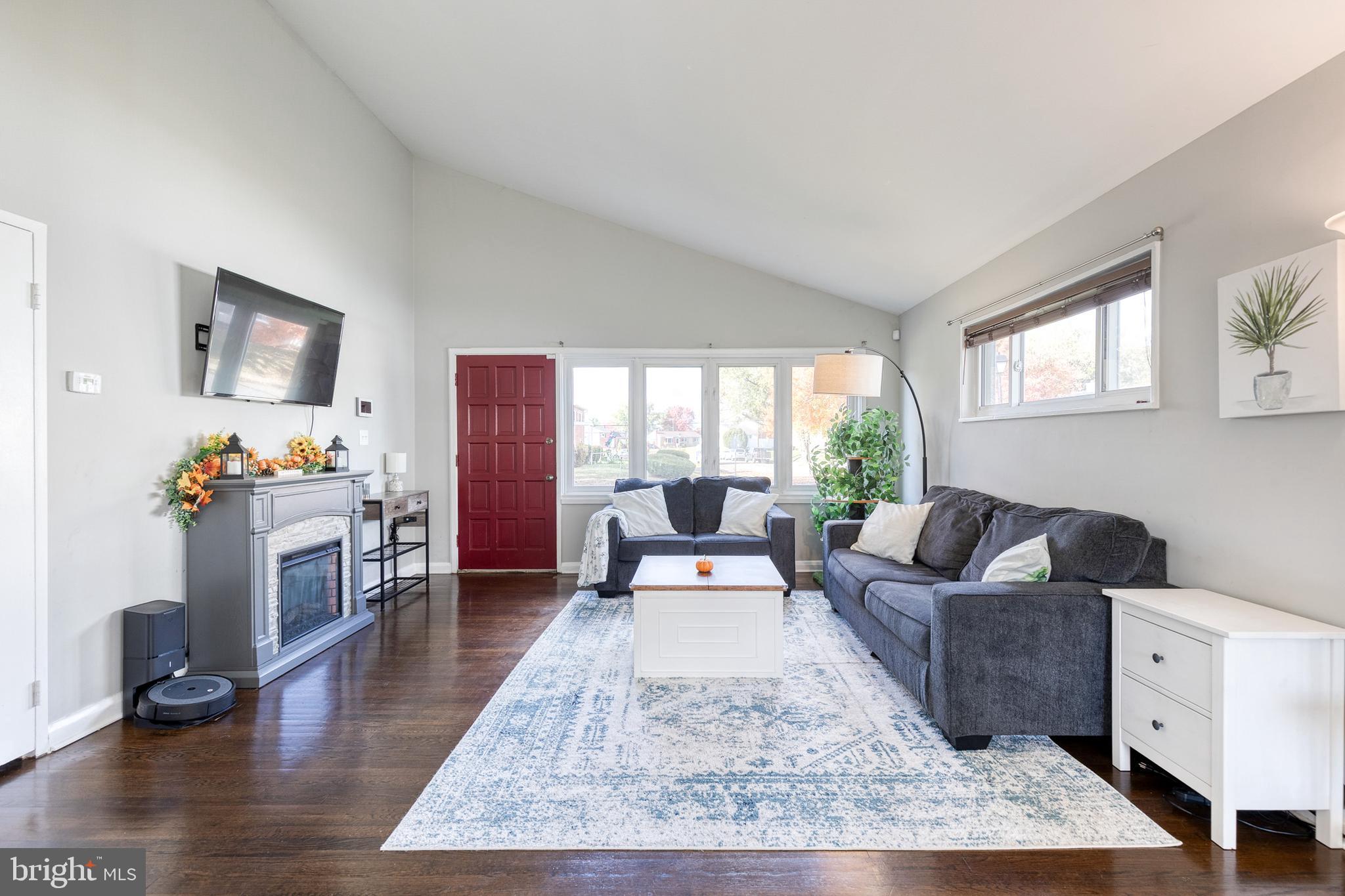 913 Marksworth Road Catonsville, MD 21228 - Photo 5 of 36 a living room with furniture and a flat screen tv