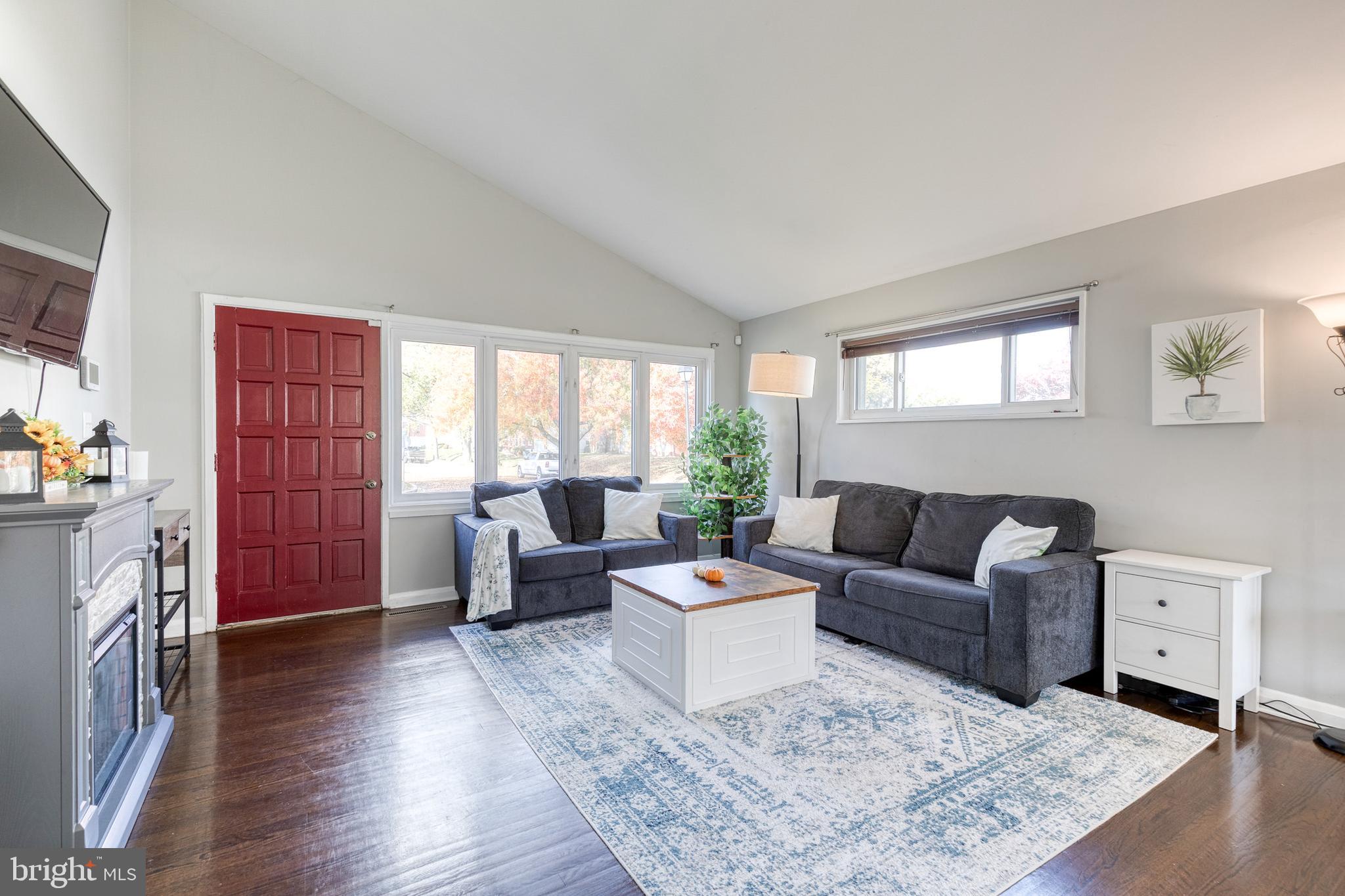 913 Marksworth Road Catonsville, MD 21228 - Photo 6 of 36 a living room with furniture and a fireplace