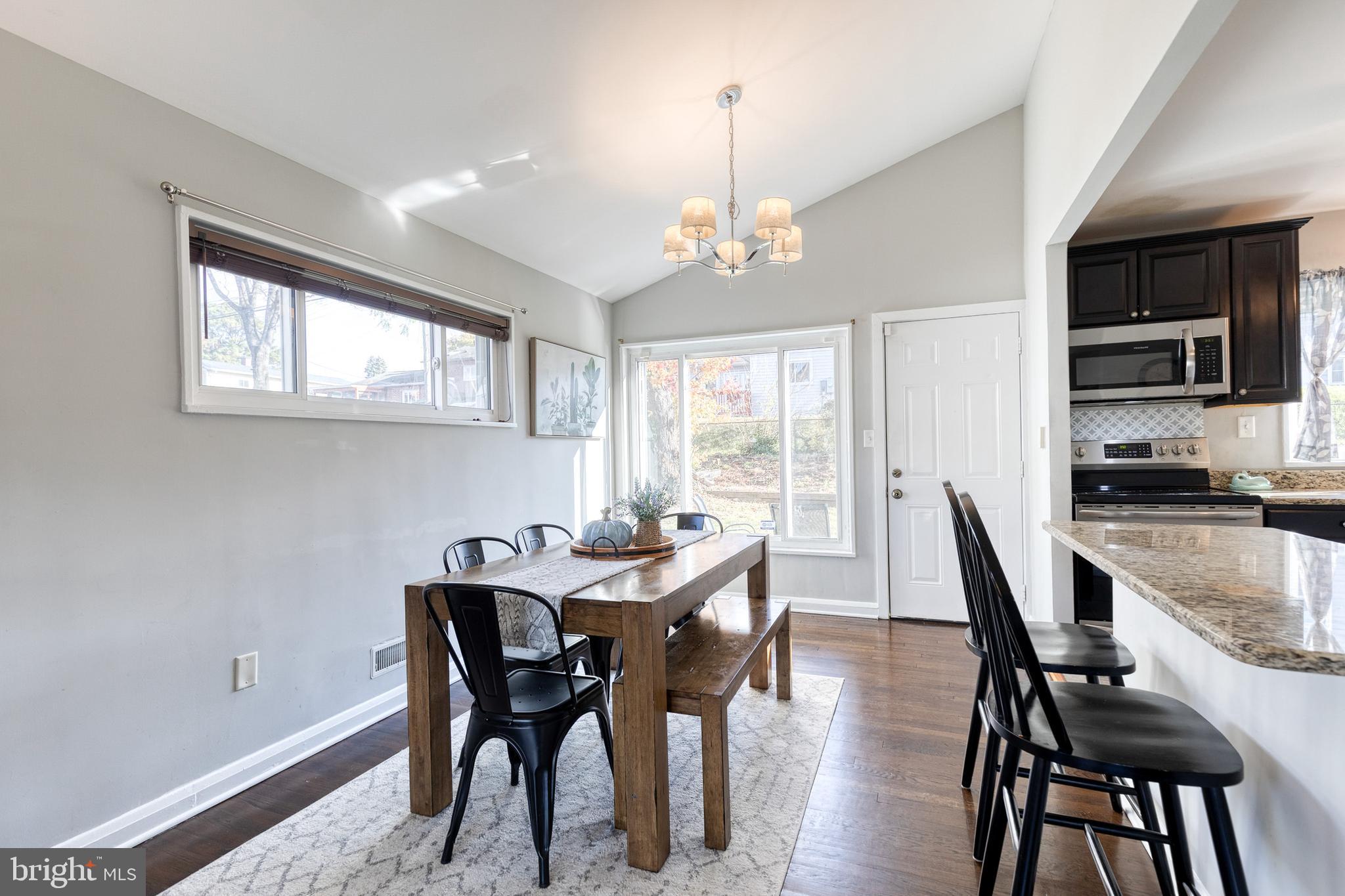 913 Marksworth Road Catonsville, MD 21228 - Photo 7 of 36 a view of a dining room with furniture window and wooden floor