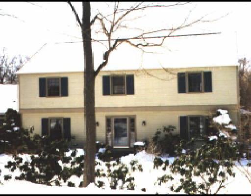 25 Wilton Road West Ridgefield, CT 06877 - Photo 1 of 1 a front view of a house with a yard