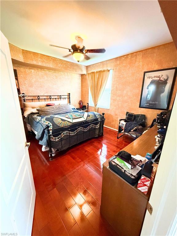 8490 Kingbird Loop, Unit 930 Estero, FL 33967 - Photo 10 of 12 Bedroom with hardwood / wood-style floors and a ceiling fan