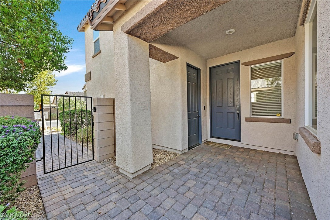 1106 Langston Ranch Avenue Henderson, NV 89002 - Photo 27 of 36 A private entryway leads to a well-maintained courtyard, blending privacy with charm.