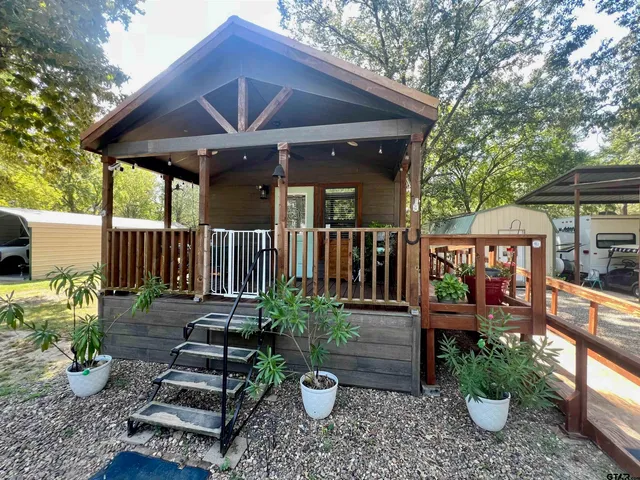 a view of a patio with chairs and plants