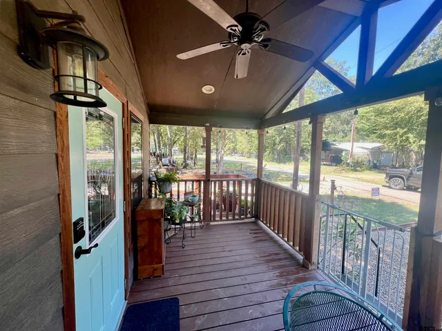 a view of a porch with wooden floor