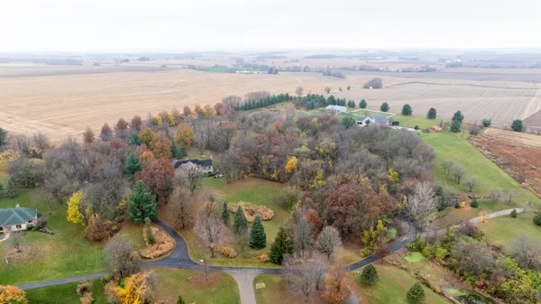 a front view of house with yard and green space