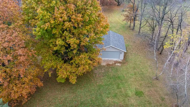 a living room with furniture a chandelier and a rug