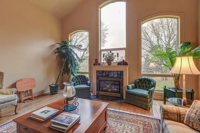 a bedroom with furniture and a window