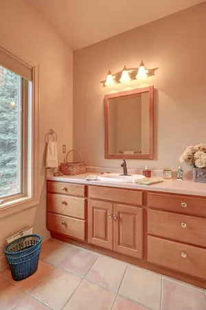 a kitchen with a sink appliances and cabinets