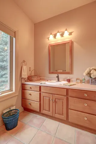 a kitchen with a sink appliances and cabinets