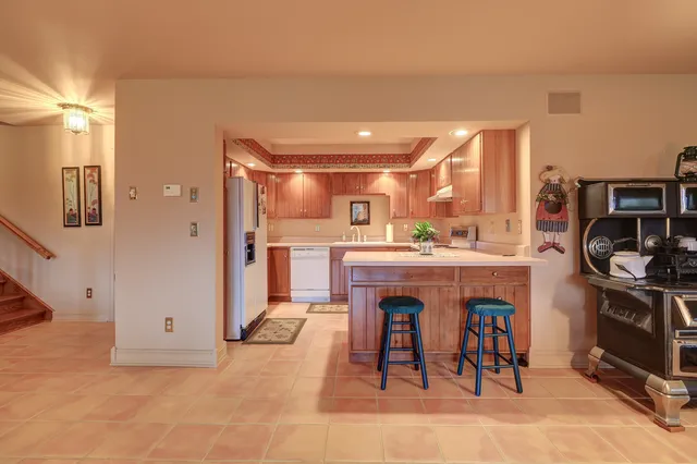 a view of a field with a trees in the background