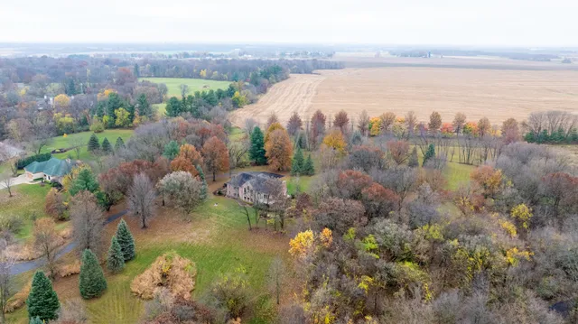 a backyard of a house with yard and outdoor seating