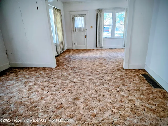 a bathroom with a toilet and a bath tub