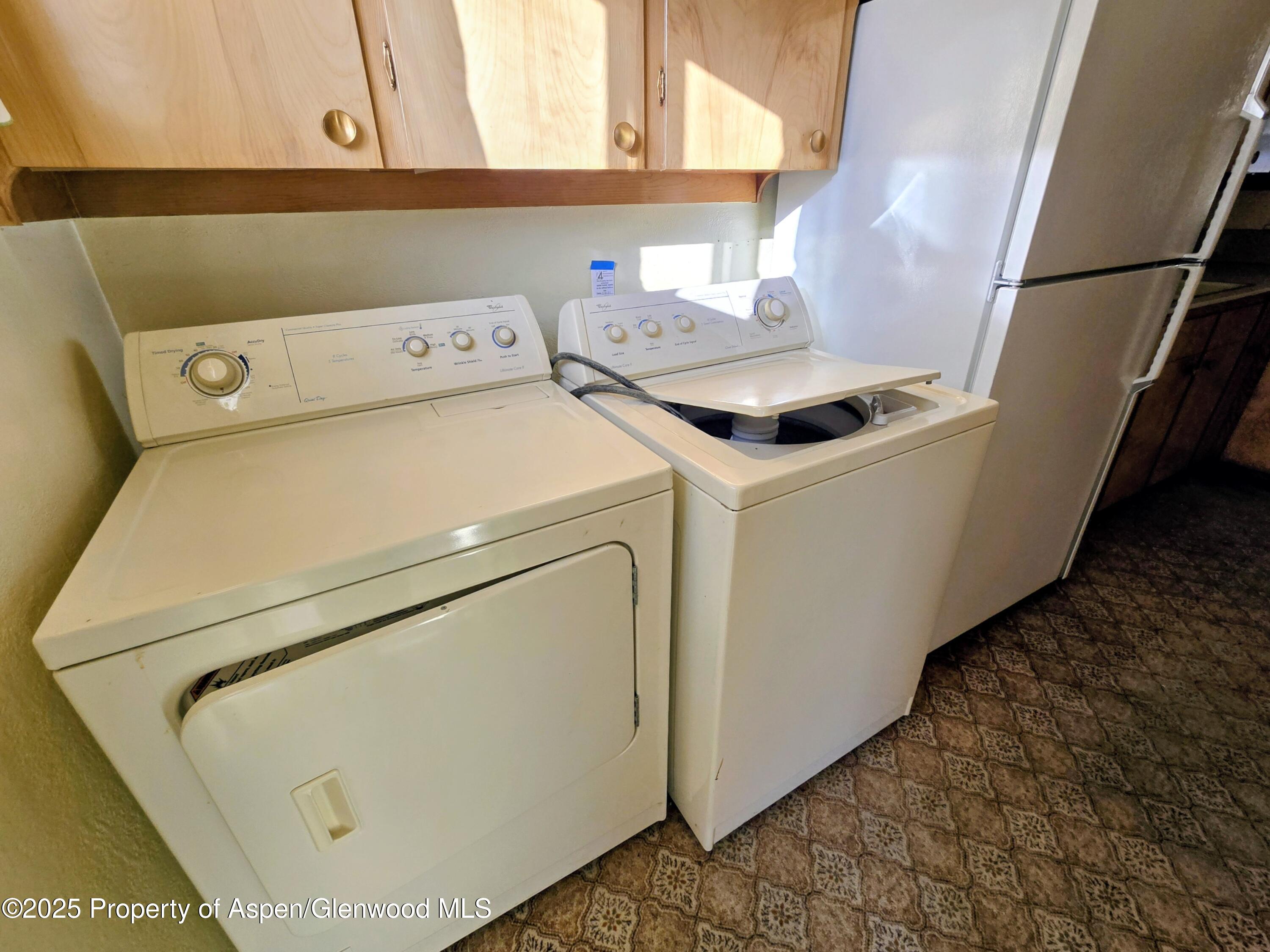 720 Barclay Street Craig, CO 81625 - Photo 14 of 22 a utility room with dryer and washer