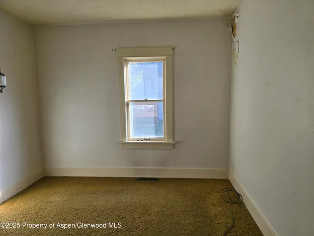 a bedroom with window