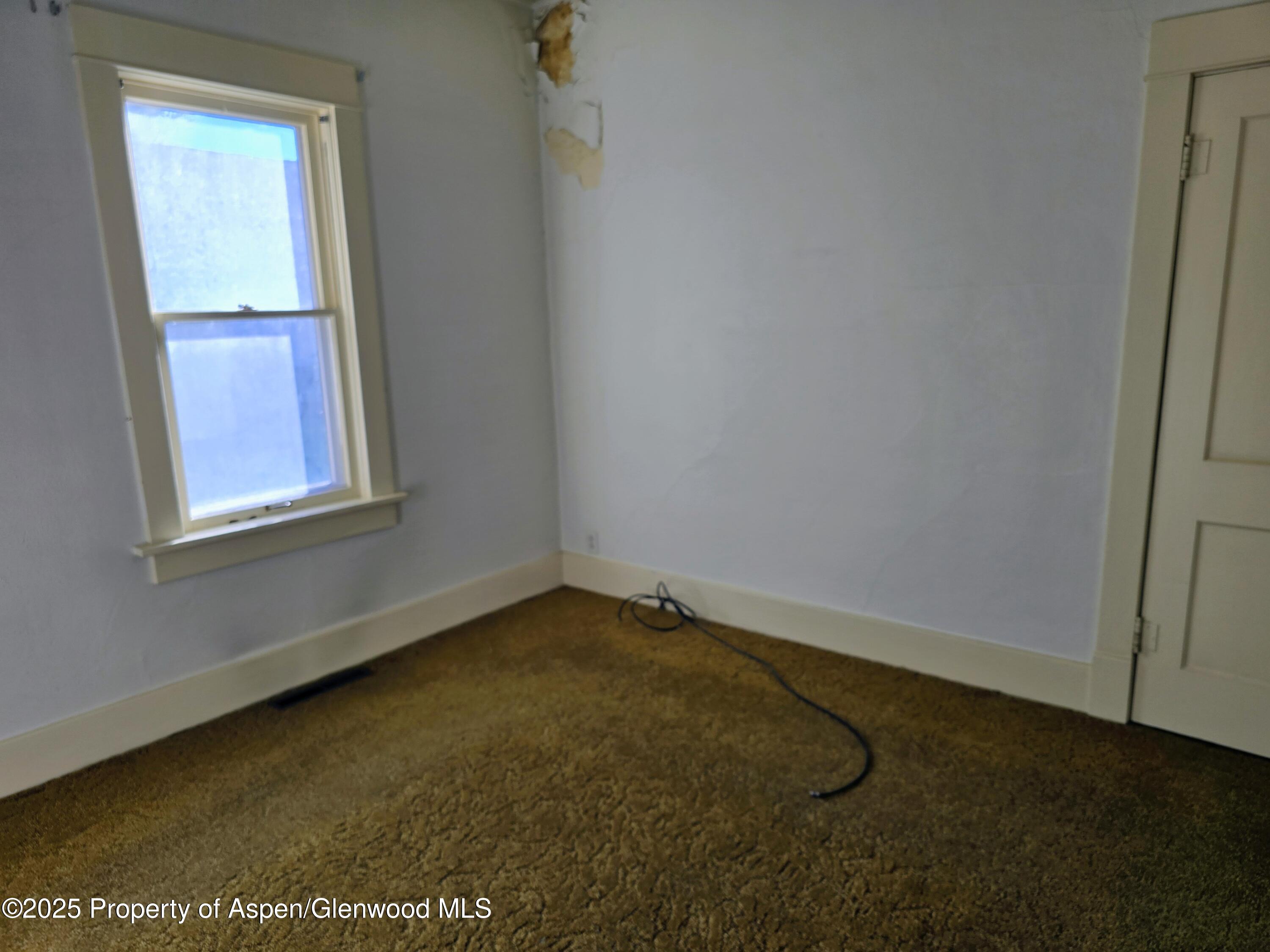 720 Barclay Street Craig, CO 81625 - Photo 17 of 22 an empty room with a window