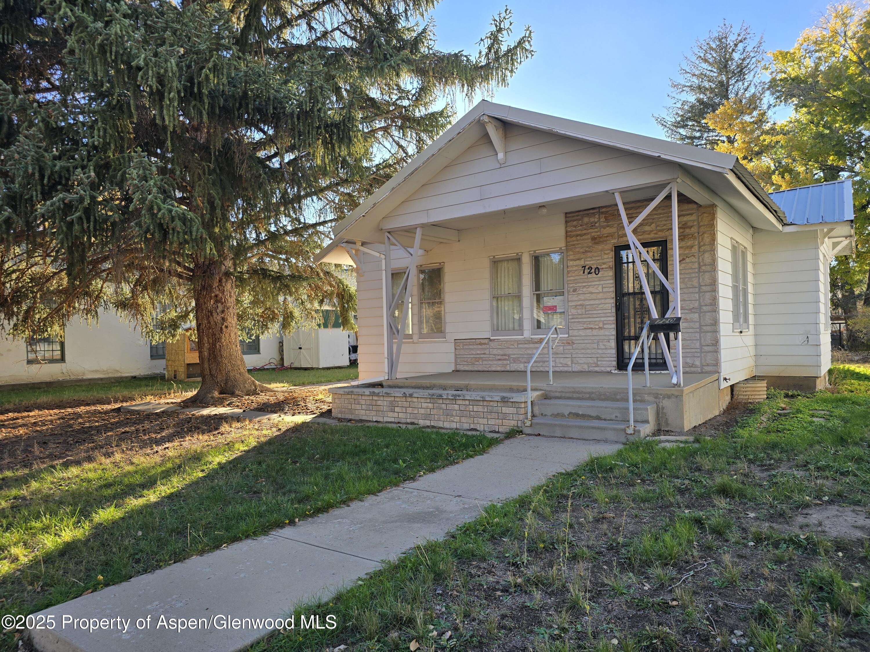 720 Barclay Street Craig, CO 81625 - Photo 2 of 22 a front view of a house with a yard