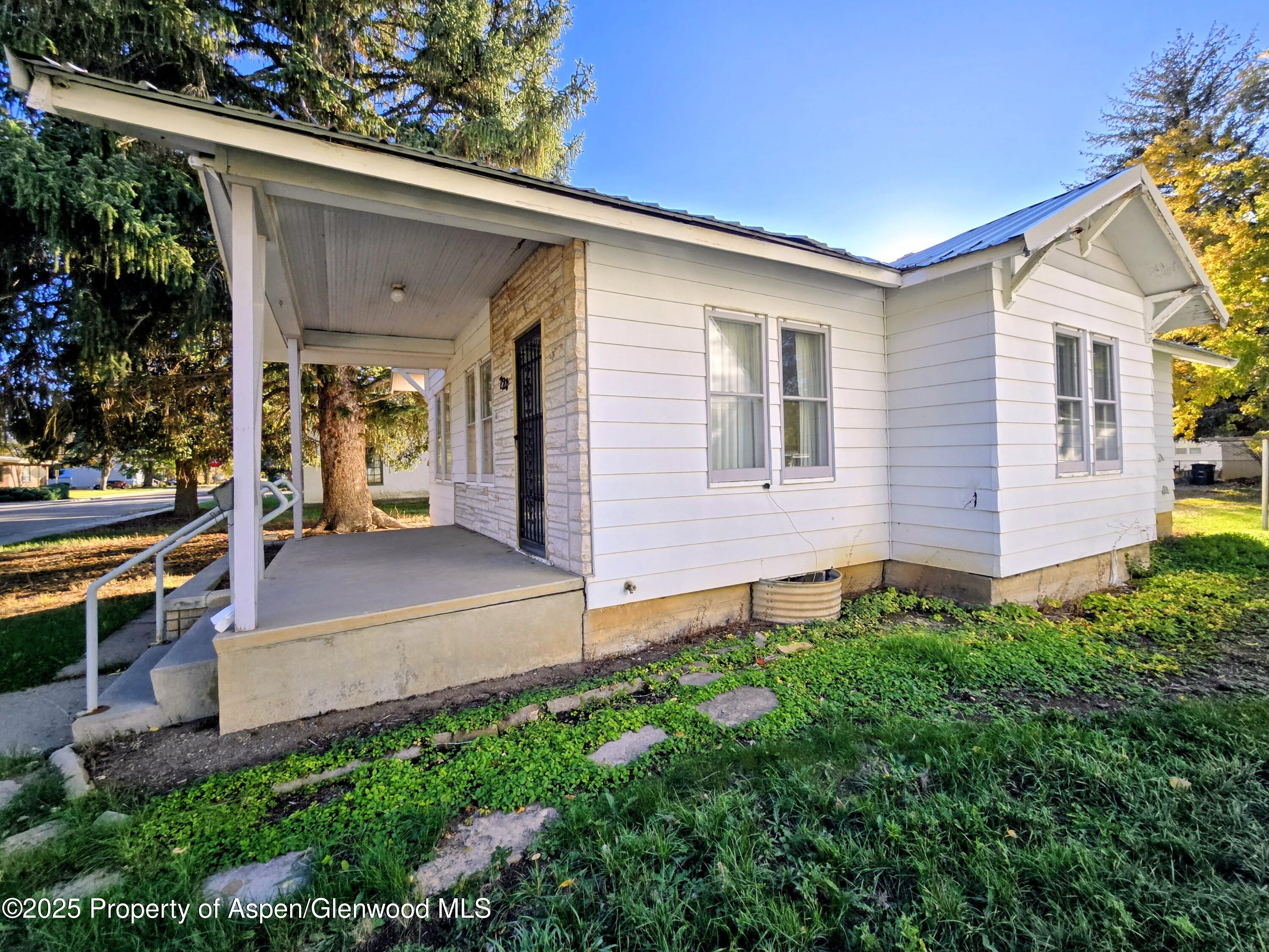 720 Barclay Street Craig, CO 81625 - Photo 3 of 22 front view of a house with a yard