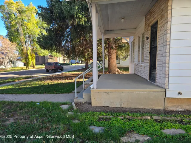 a kitchen with stainless steel appliances granite countertop a stove a refrigerator a sink dishwasher and wooden cabinets with a granite countertops
