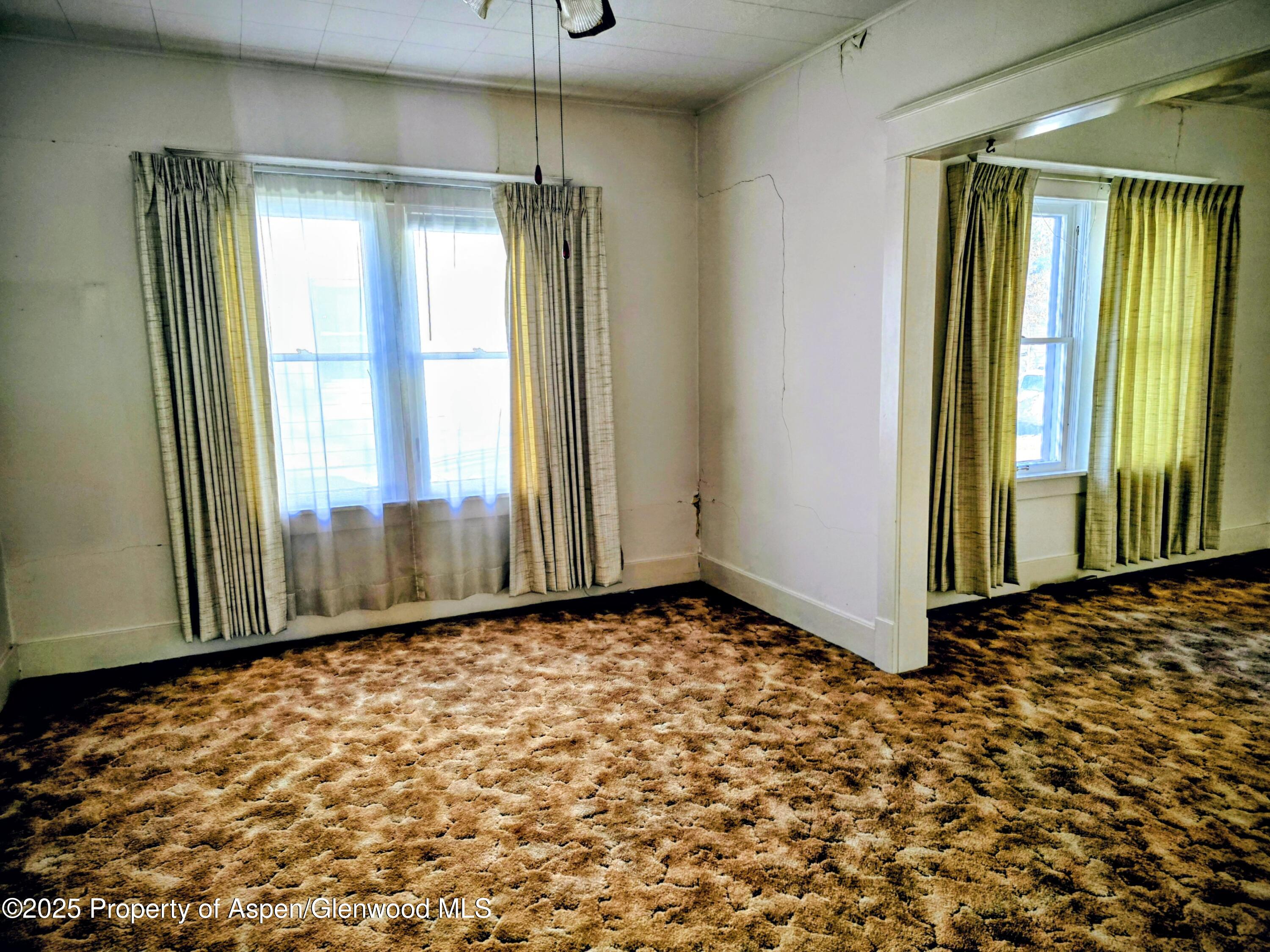 720 Barclay Street Craig, CO 81625 - Photo 10 of 22 a view of an empty room with a window