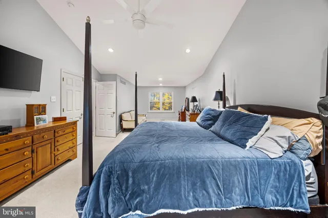 a view of a dining room and livingroom with furniture wooden floor chandelier