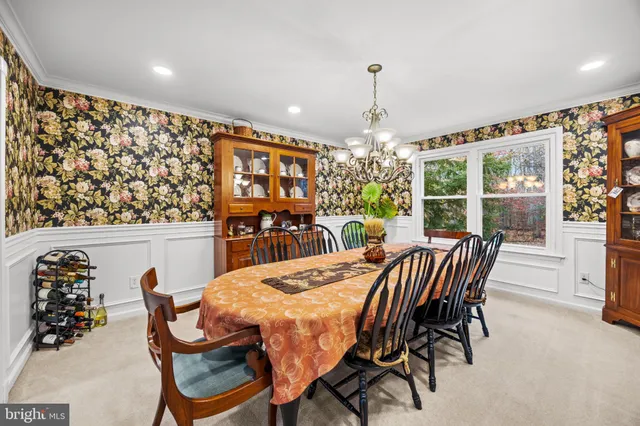 a bathroom with a toilet sink vanity and mirror