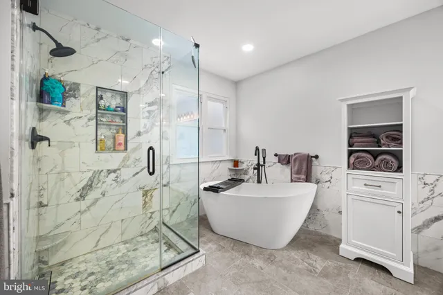 a view of a hallway with wooden floor and stairs