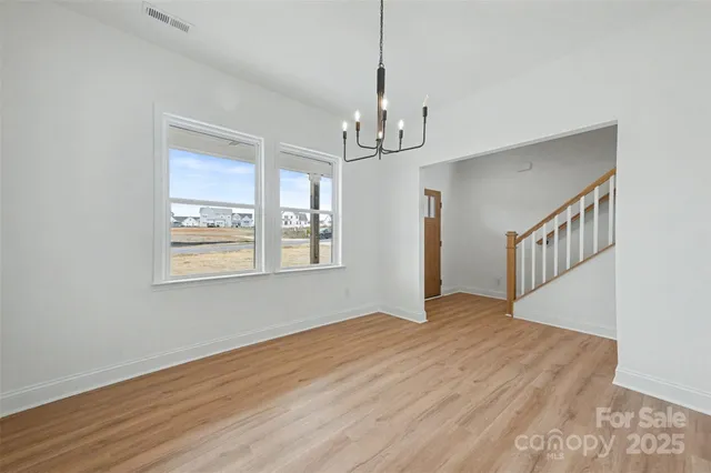 a spacious bedroom with a bed and a couch