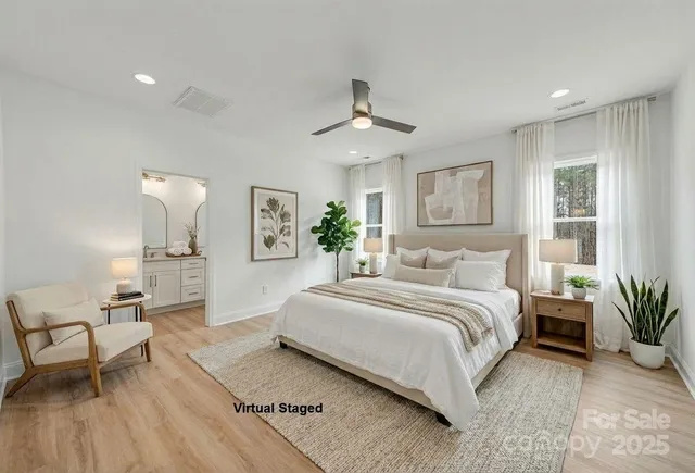 a view of staircase with white walls and door