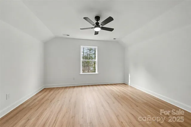 a picture of a bench in front of a wall