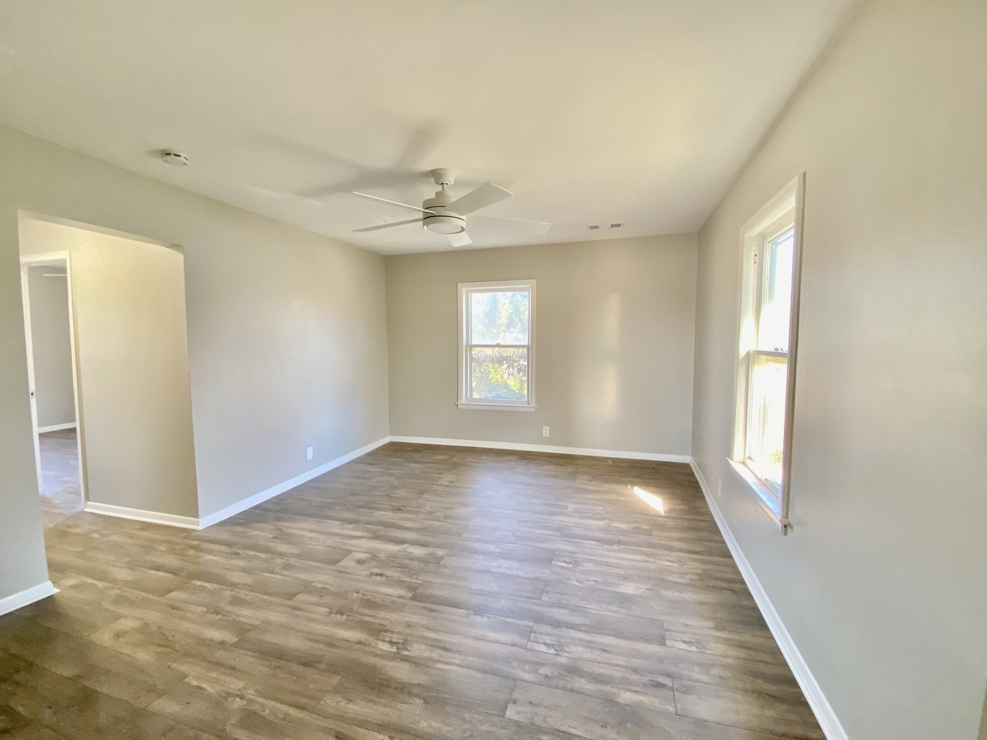 5543 West Margaret Street, Unit B Monee, IL 60449 - Photo 2 of 11 wooden floor in an empty room with a window