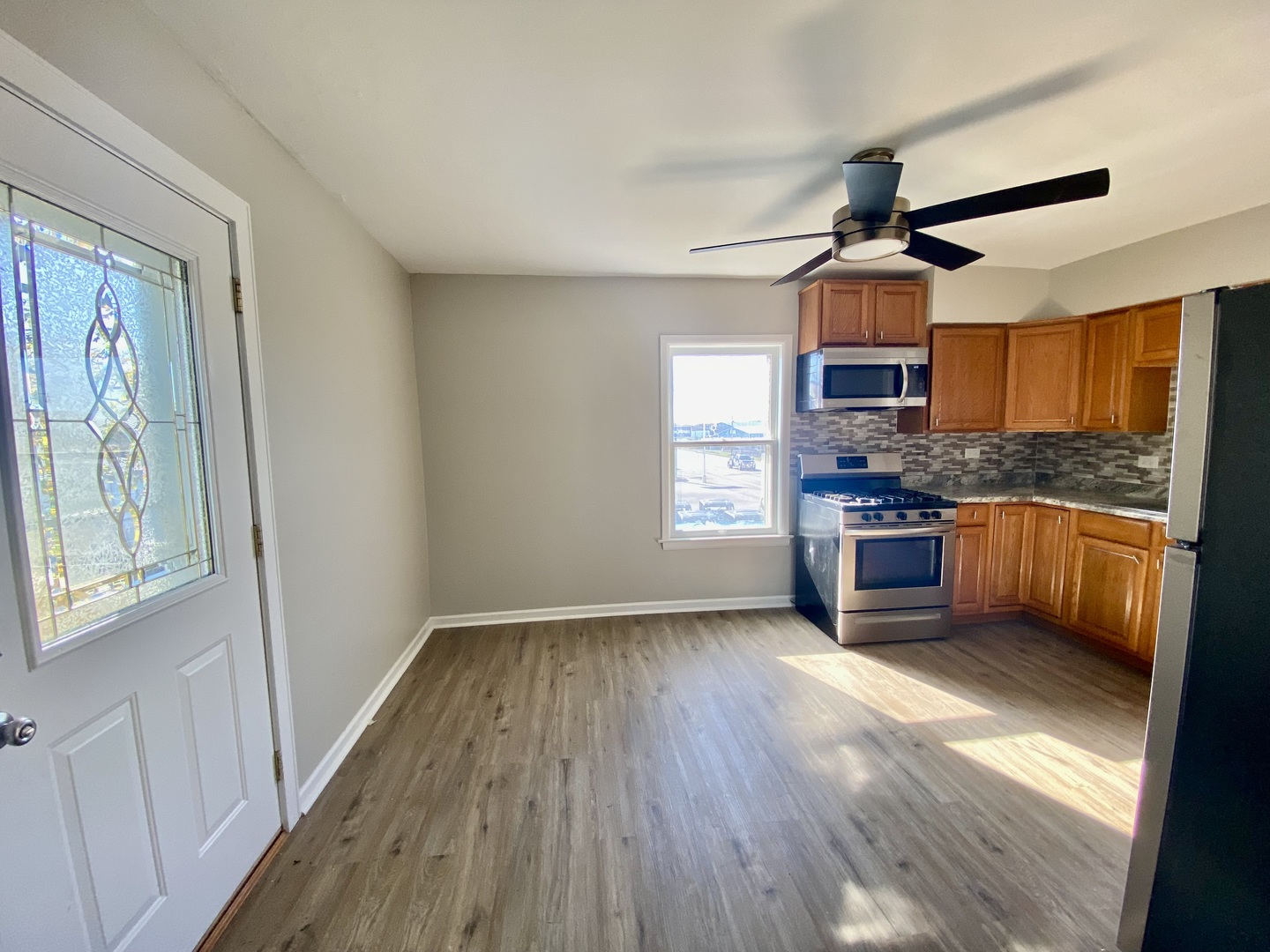 5543 West Margaret Street, Unit B Monee, IL 60449 - Photo 6 of 11 a view of kitchen with sink microwave and stove top oven