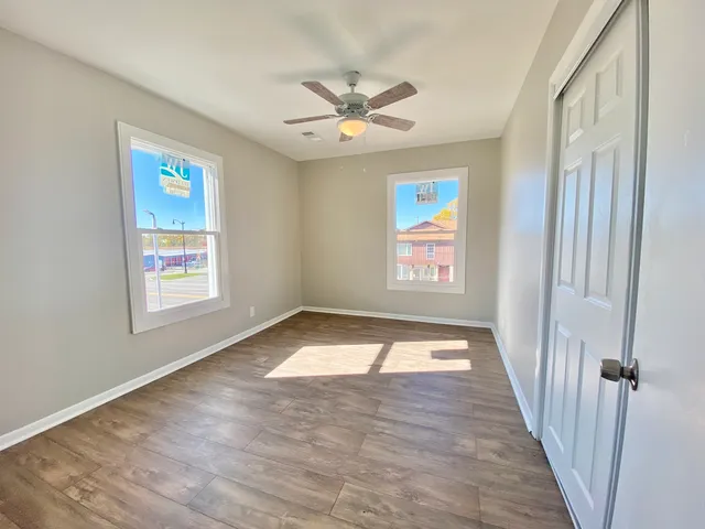 a view of an empty room with a window