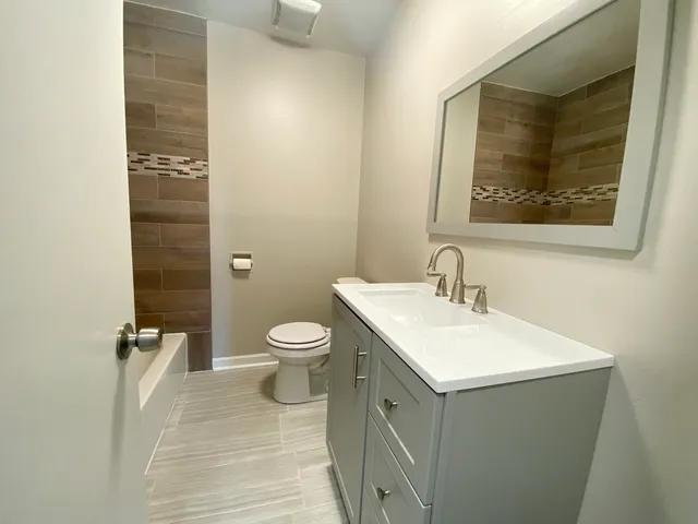a bathroom with a sink and a toilet