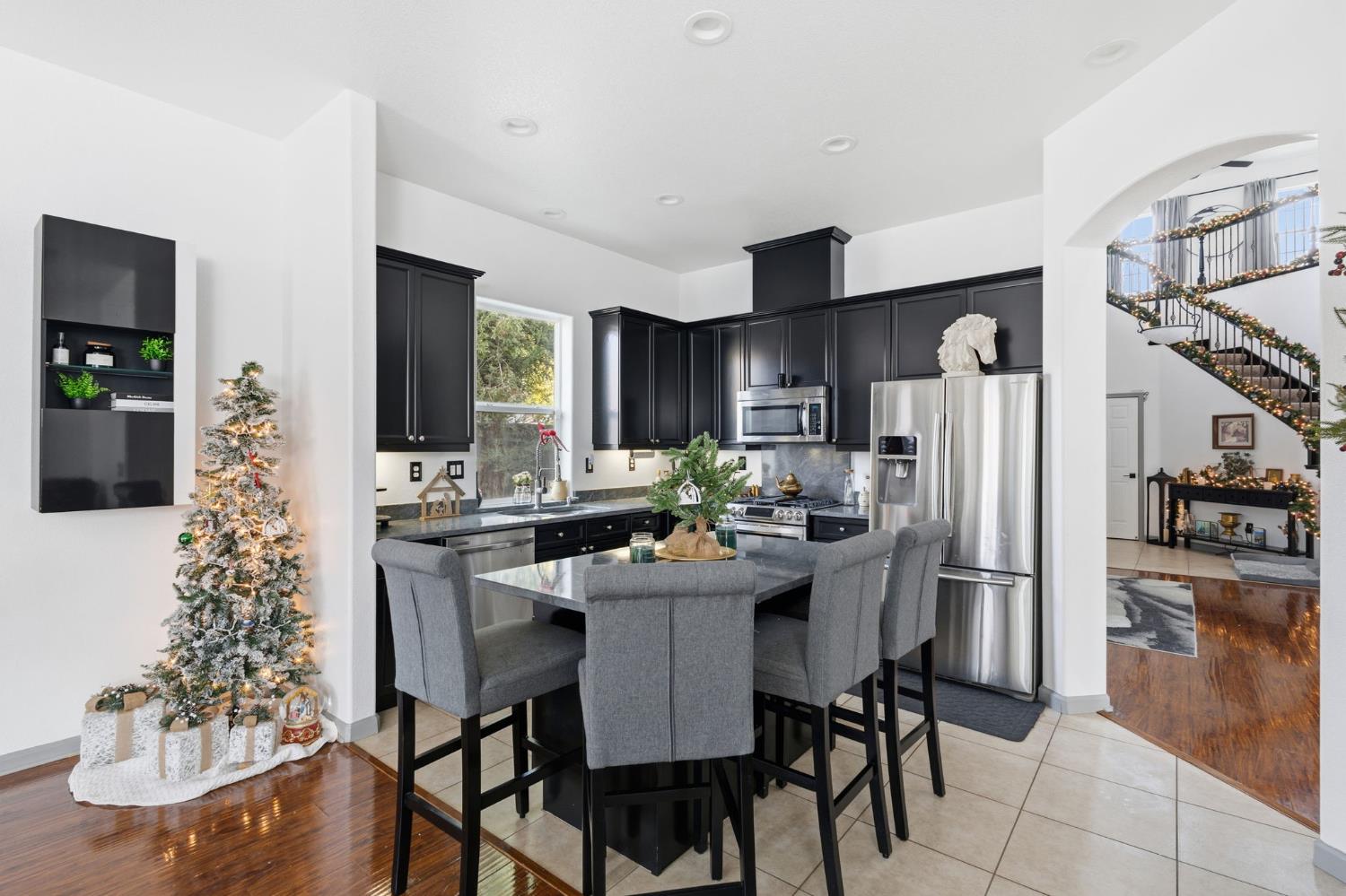4215 Riopel Avenue Denair, CA 95316 - Photo 11 of 62 a kitchen with a table and chairs in it