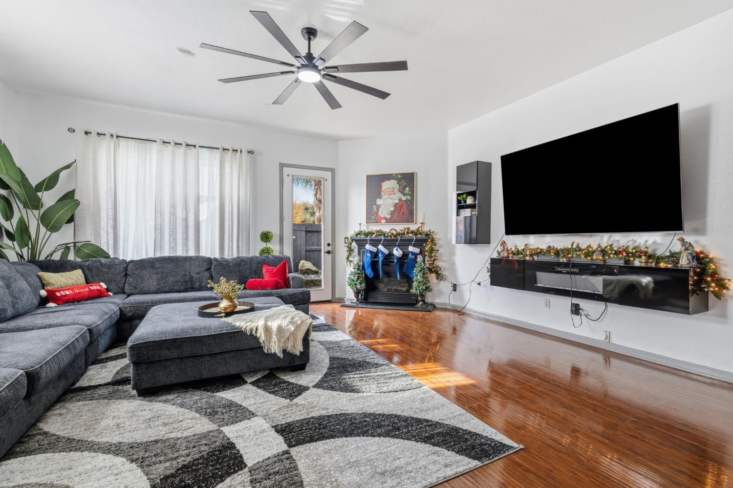 4215 Riopel Avenue Denair, CA 95316 - Photo 15 of 62 a living room with furniture and a flat screen tv