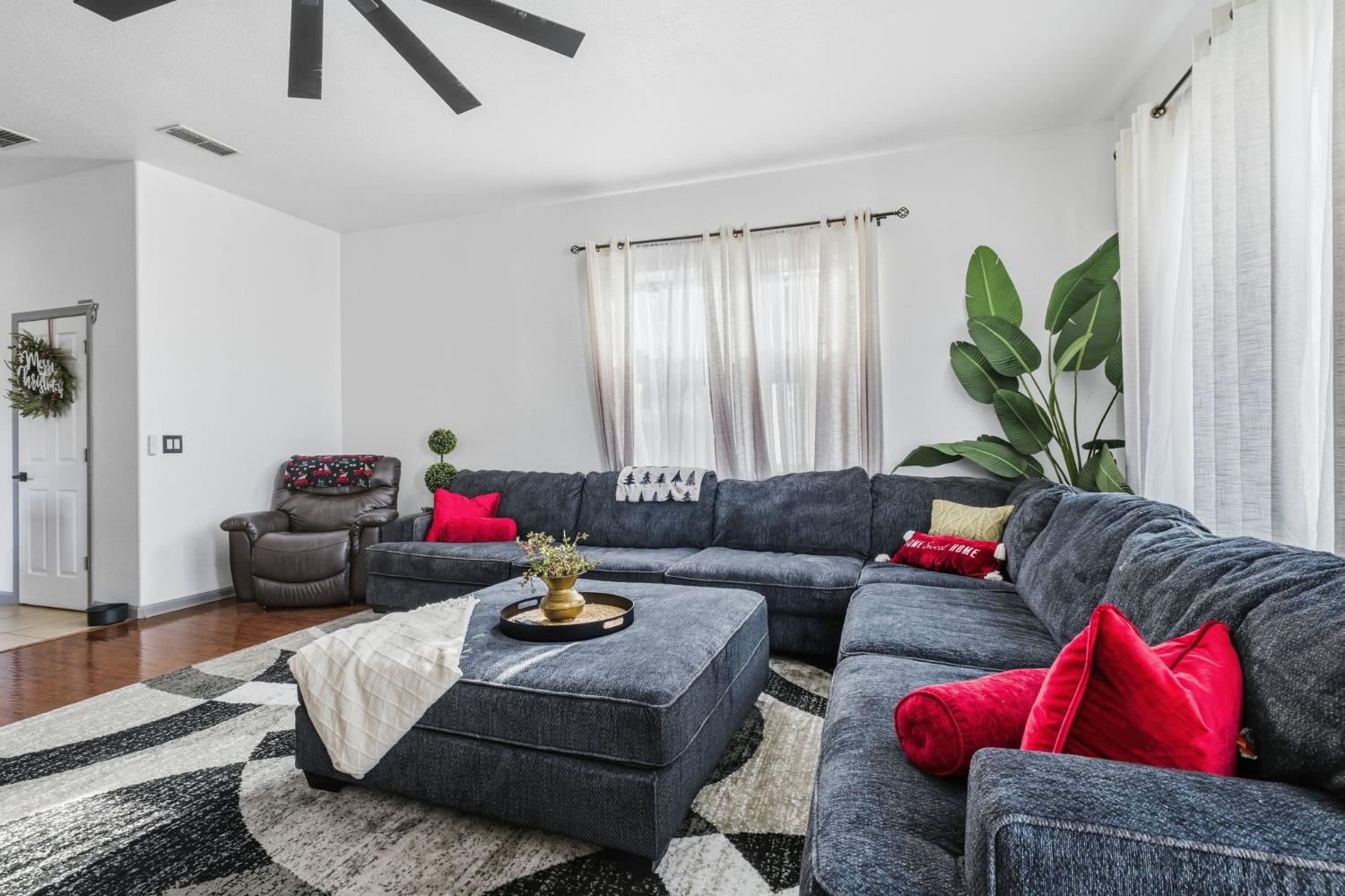 4215 Riopel Avenue Denair, CA 95316 - Photo 16 of 62 a living room with furniture and a potted plant