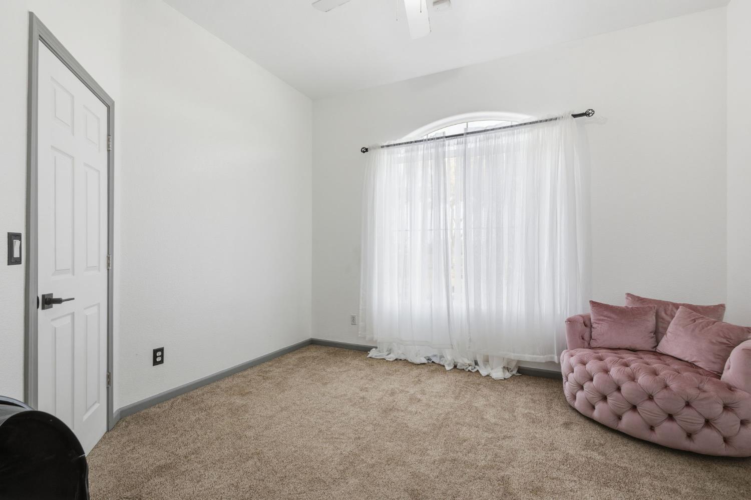 4215 Riopel Avenue Denair, CA 95316 - Photo 17 of 62 a view of room with windows and a ceiling fan