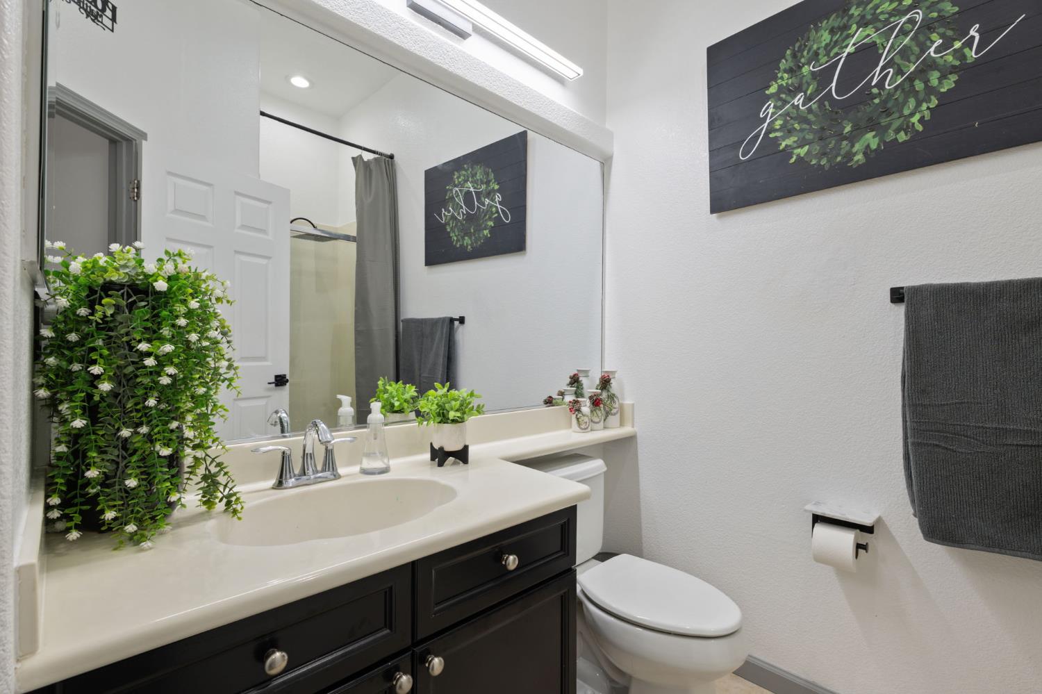 4215 Riopel Avenue Denair, CA 95316 - Photo 18 of 62 a bathroom with a sink toilet and mirror