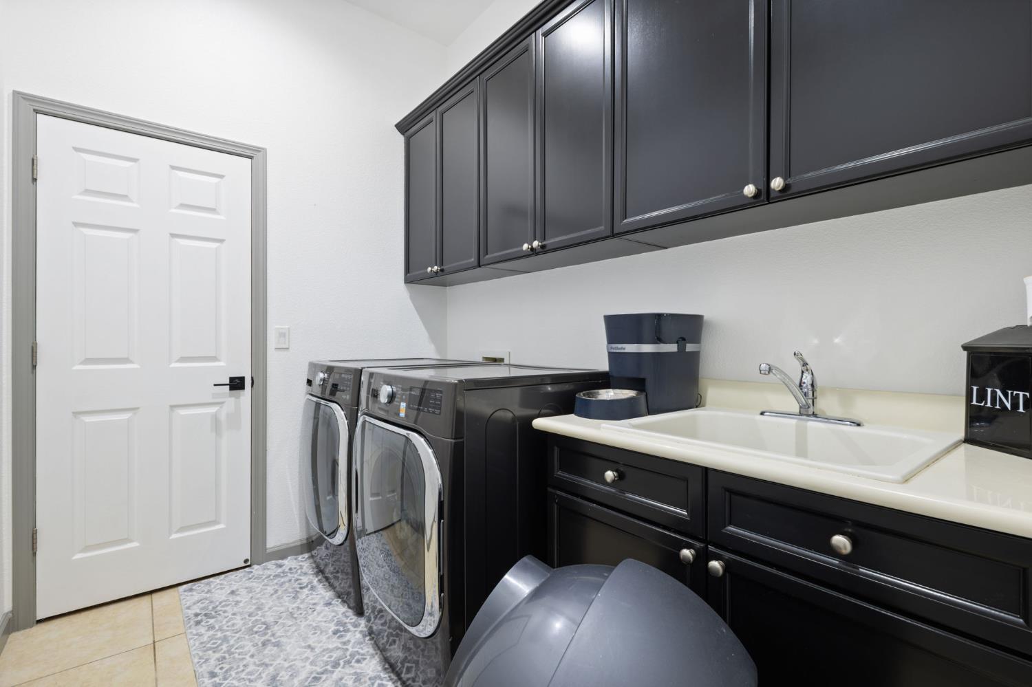 4215 Riopel Avenue Denair, CA 95316 - Photo 19 of 62 a room with a sink cabinets and utility
