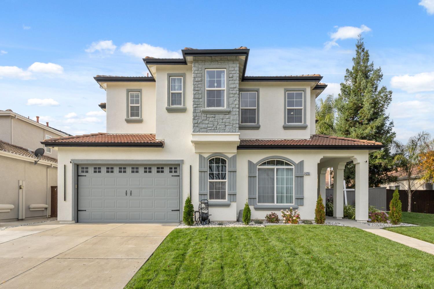 4215 Riopel Avenue Denair, CA 95316 - Photo 2 of 62 front view of a house with a yard