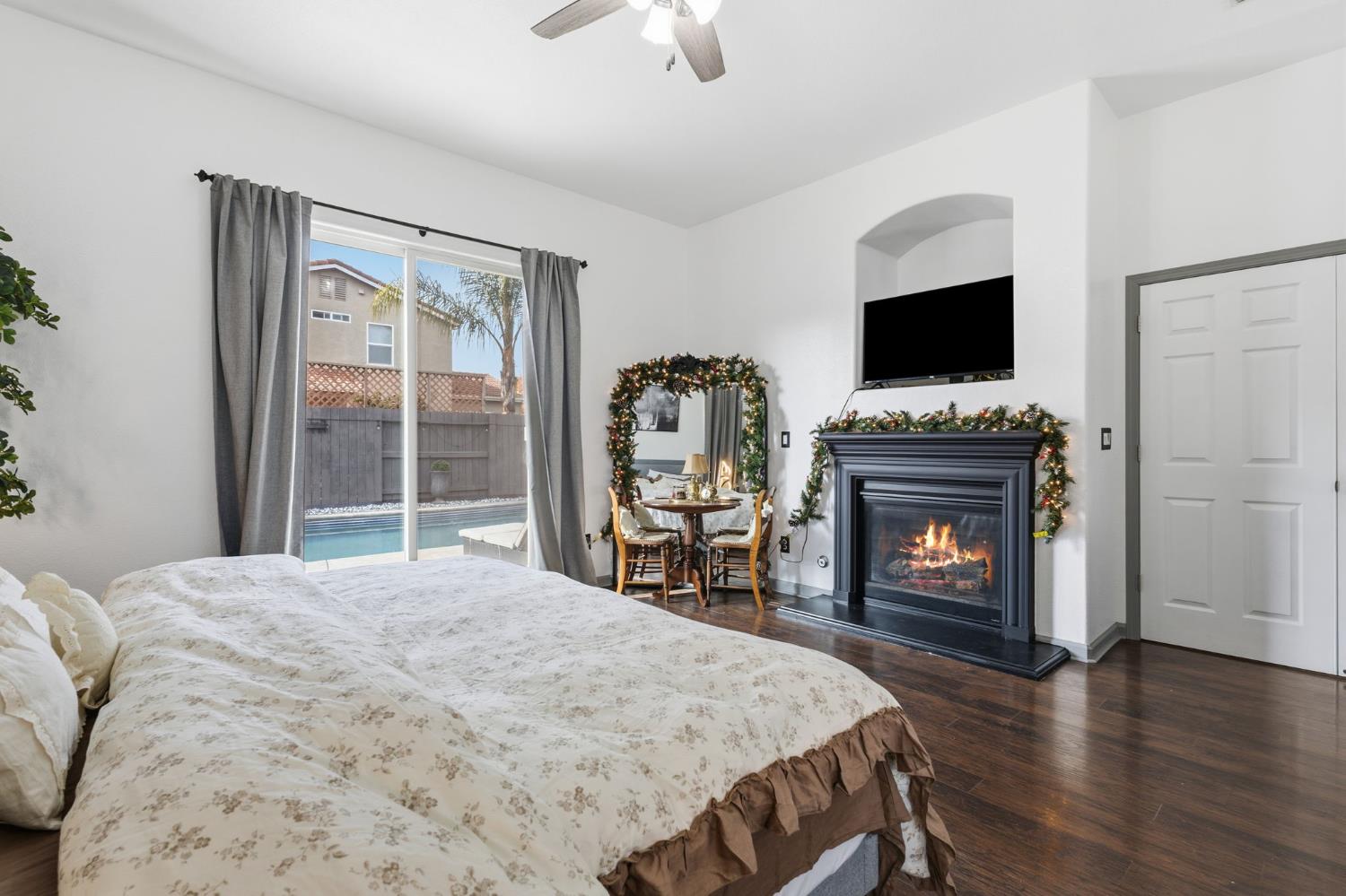 4215 Riopel Avenue Denair, CA 95316 - Photo 21 of 62 a bedroom with a bed and a fireplace