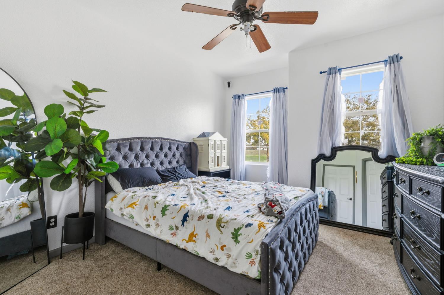 4215 Riopel Avenue Denair, CA 95316 - Photo 28 of 62 a bedroom with a bed and a potted plant