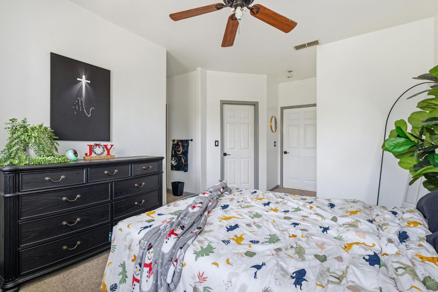 4215 Riopel Avenue Denair, CA 95316 - Photo 29 of 62 a bedroom with a bed and a dresser in it