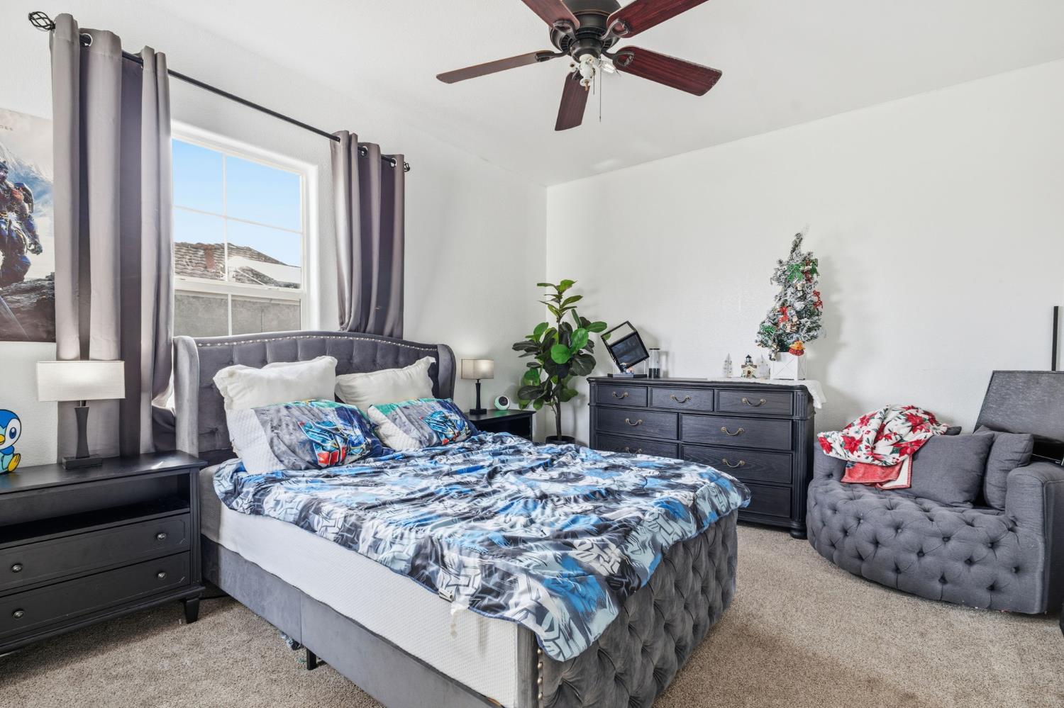 4215 Riopel Avenue Denair, CA 95316 - Photo 34 of 62 a bedroom with a bed and a window