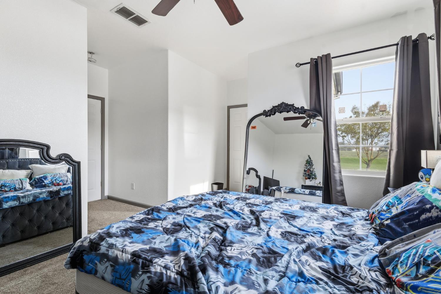 4215 Riopel Avenue Denair, CA 95316 - Photo 35 of 62 a bedroom with a bed and a dresser