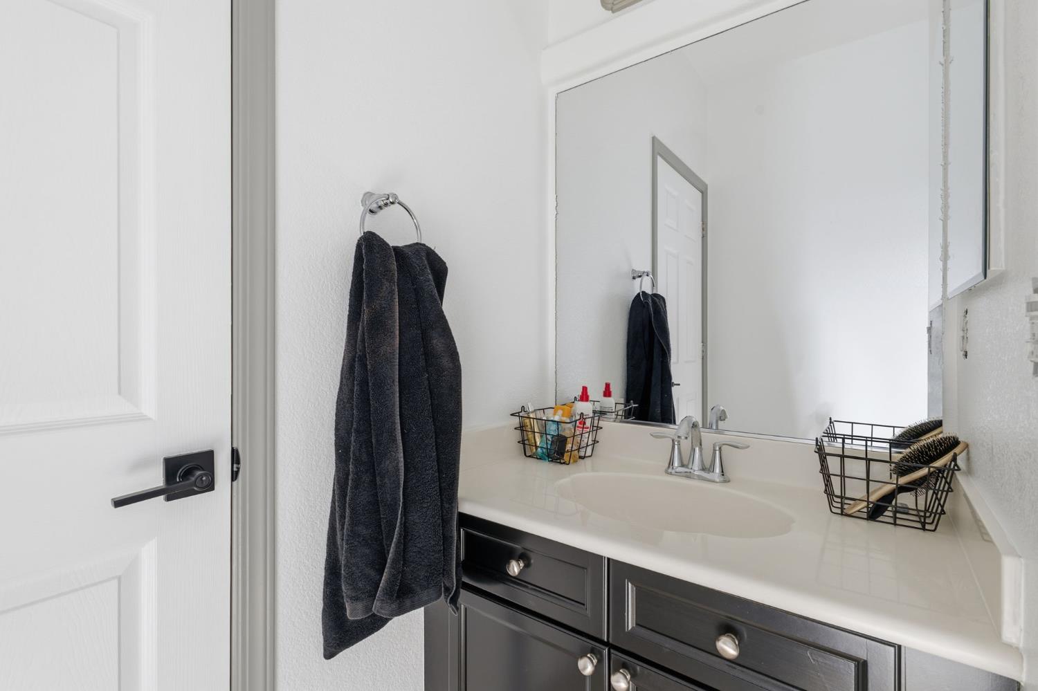 4215 Riopel Avenue Denair, CA 95316 - Photo 36 of 62 a bathroom with a sink and a mirror