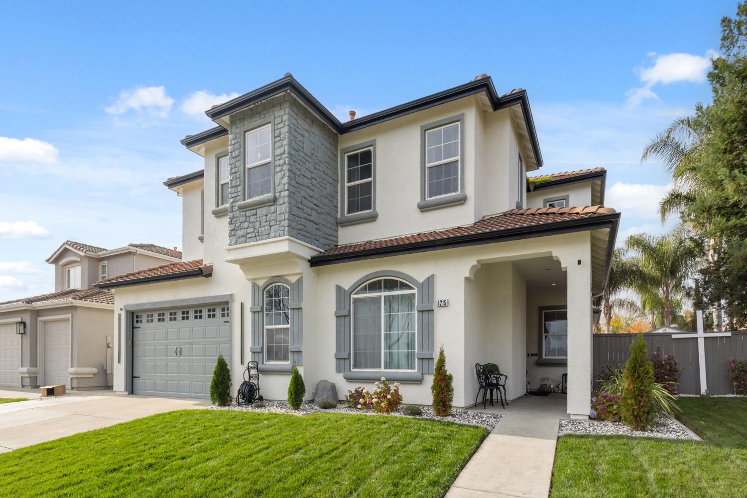 4215 Riopel Avenue Denair, CA 95316 - Photo 4 of 62 a front view of a house with garden