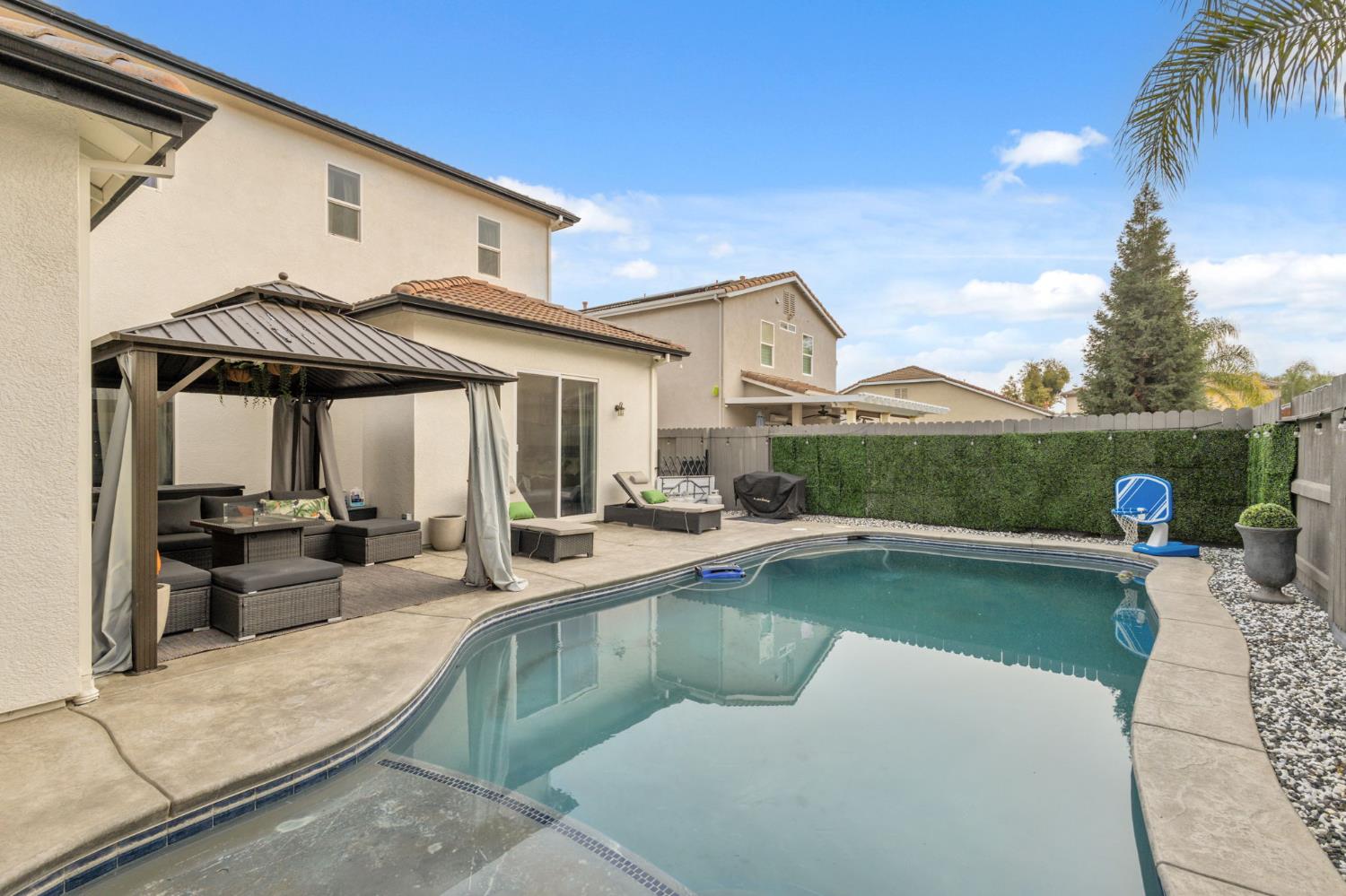 4215 Riopel Avenue Denair, CA 95316 - Photo 41 of 62 a view of a house with swimming pool and sitting area